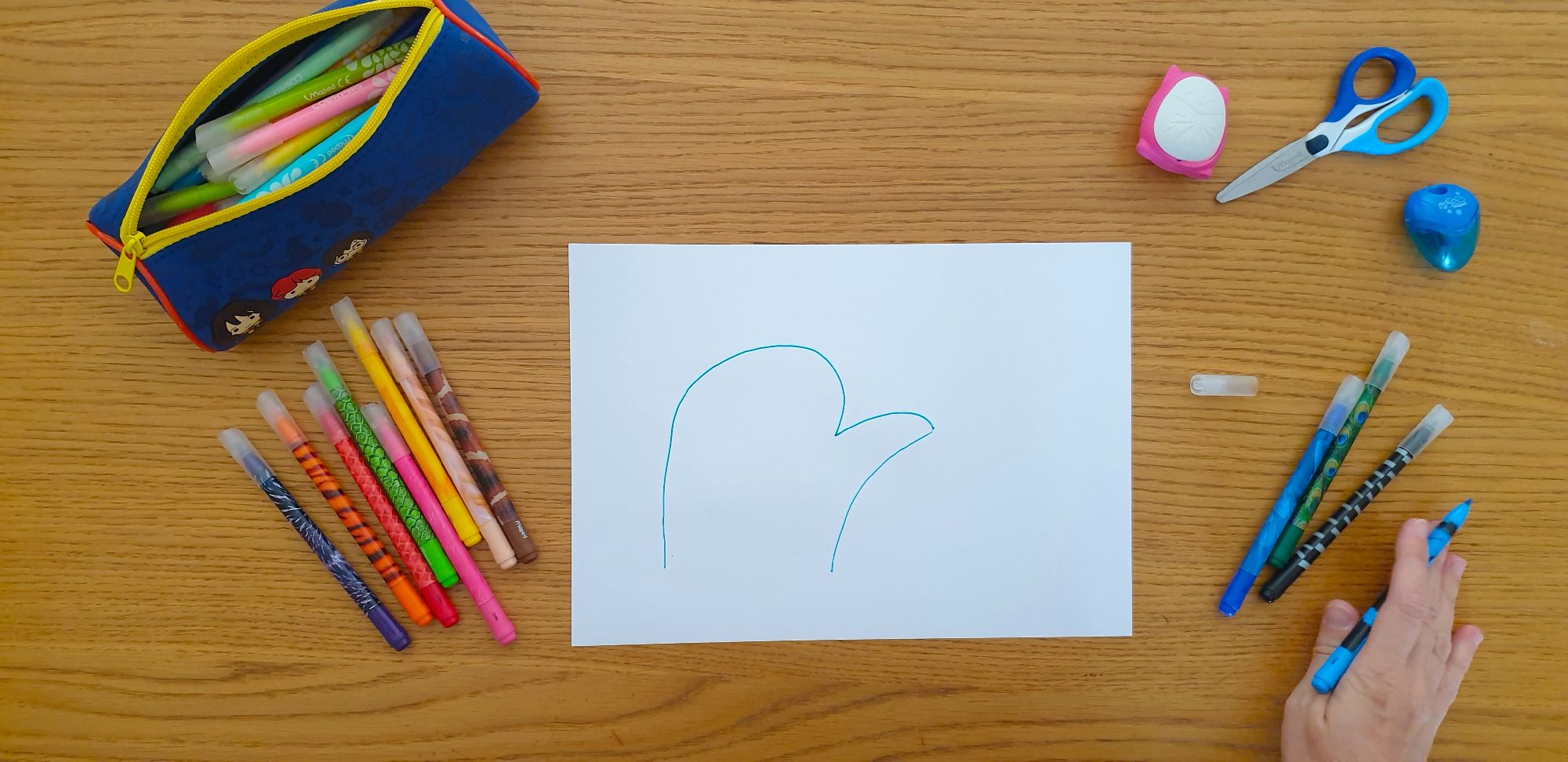 A picture of the outline of an elephant on a piece of paper laying on a desk