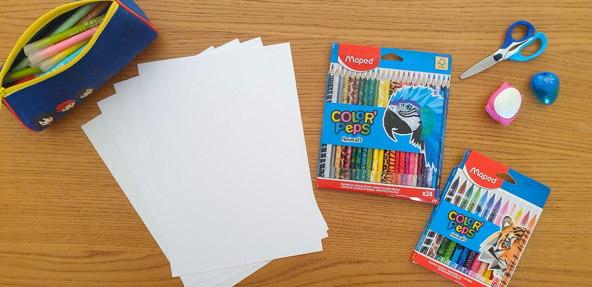 Stationery and paper laying on a desk