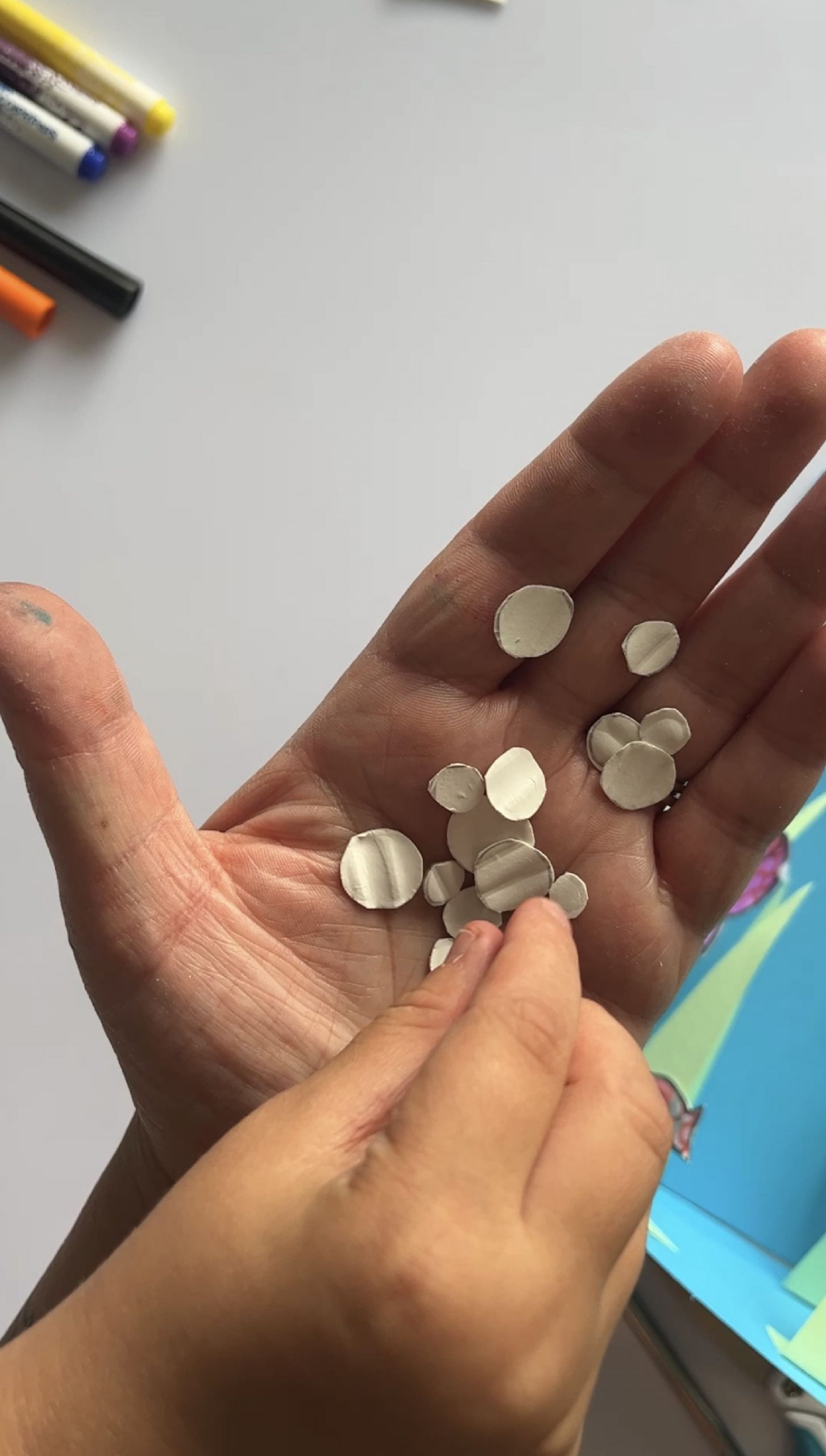 Tiny white bubbles cut out from a paper plate
