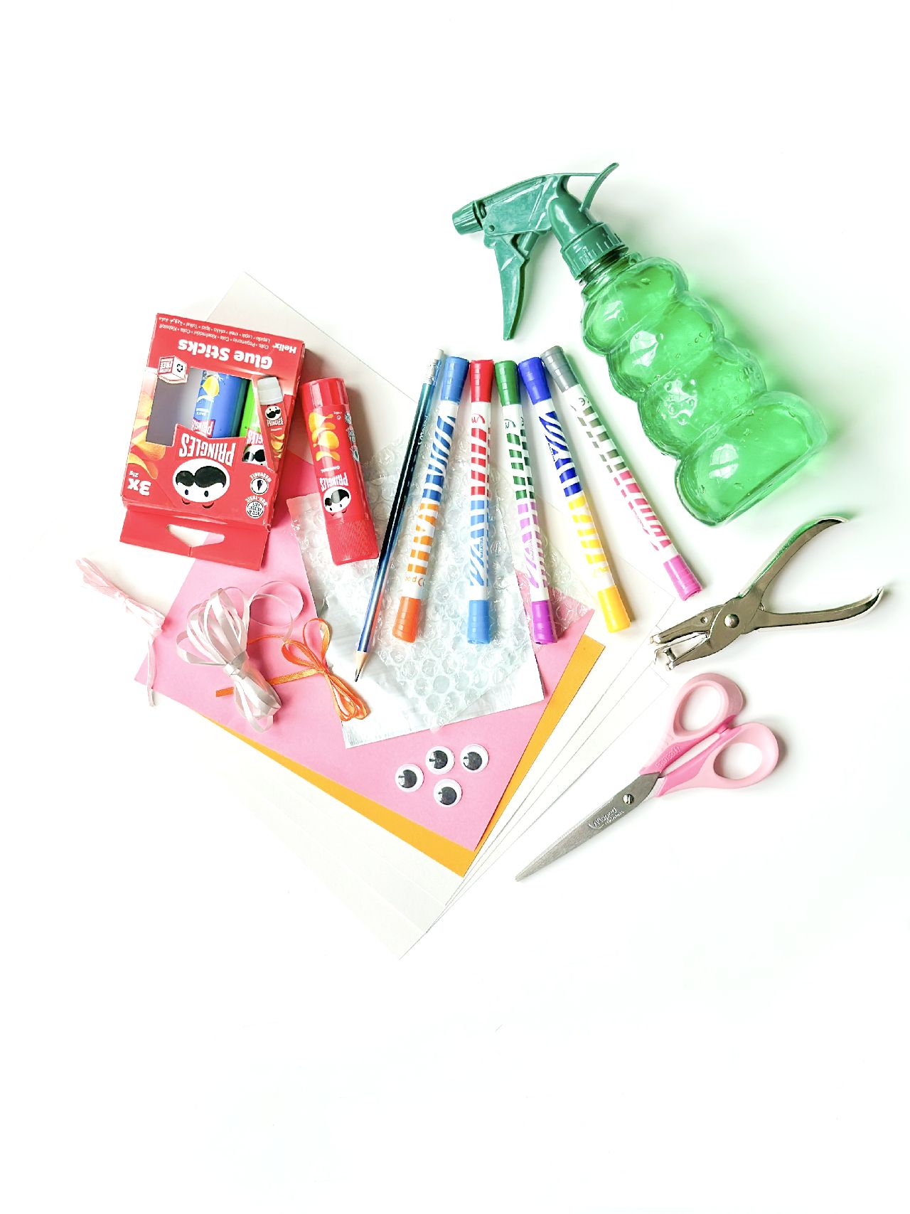 Stationery and craft tools laying on a desk