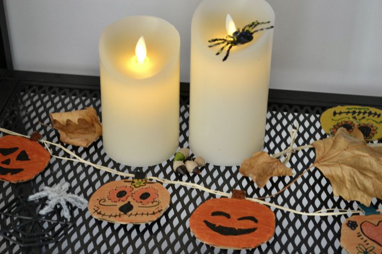 The finished decorated pumpkins attached to the string